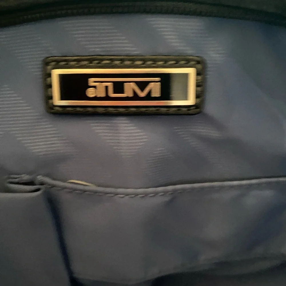 Tumi preowned definately